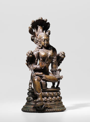 A COPPER ALLOY FIGURE OF A SNAKE GODDESS ORISSA OR BENGAL, PALA PERIOD, 11TH CENTURY