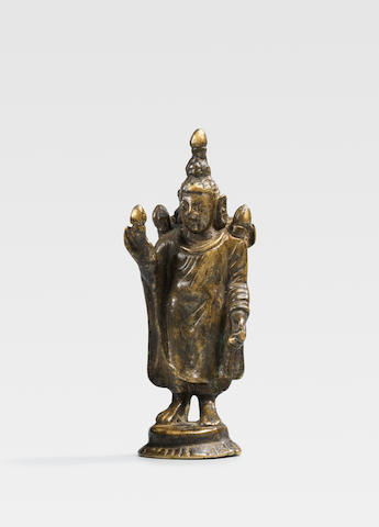 A BRASS ALLOY FIGURE OF BUDDHA CENTRAL ASIA, CIRCA 6TH CENTURY
