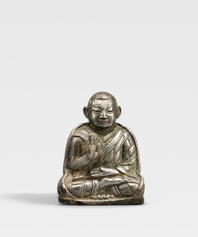 A SILVER FIGURE OF A KAGYU LAMA TIBET, CIRCA 13TH CENTURY