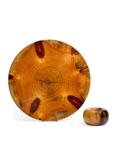 Edward Moulthrop (1916-2003) Donut Vessel and Plattervessel circa 1980, platter circa 1965figured tulipwood and pine, the first inscribed 'MOULTHROP FIGURED TULIPWOOD', the other with branded mark, inscribed 'WHITE PINE MOULTHROP'height of vessel 3 3/8in (8.5); diameter 5 3/4in (14.4cm); diameter of platter 18 1/2in (47cm) (2)