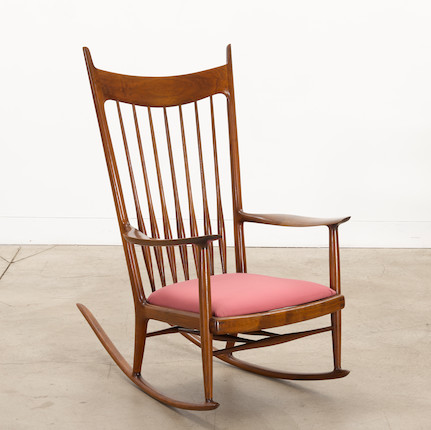 Sam Maloof (1916-2009) Rocking Chaircirca 1968walnut, upholsterybranded 'MALOOF designed made' and inscribed 'RUDOLPH 50.70'height 45in (114.5cm); width 28in (71.5cm); depth 42in (107cm) image 1