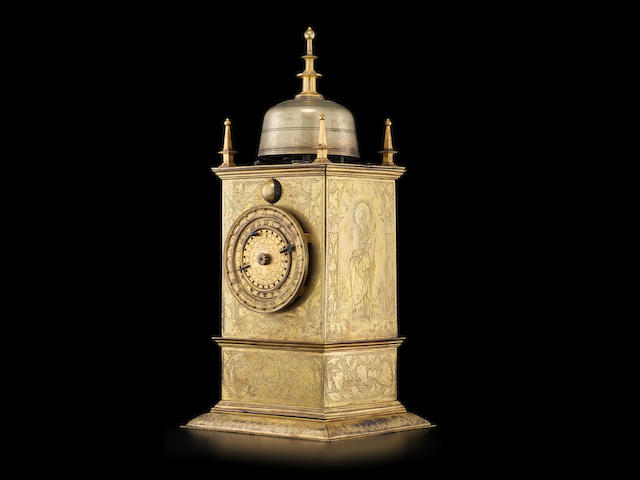 An important early gilt brass hour striking table clock with 24-hour dial, day / night indication, and alarm, the side panels with finely engraved images of the saints Christopher, Paul and Simon the Zealot, after Albrecht Durer Hans Steinmeissel, Prague, dated 1551
