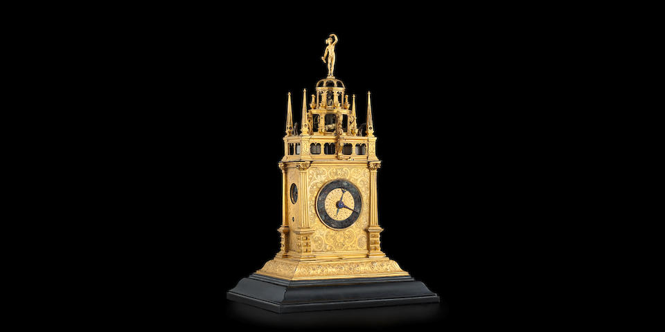 A gilt brass quarter striking automata table clock with alarm   probably Augsburg, circa 1630