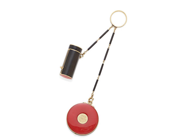 An enamel and 14K gold mirrored compact and lipstick, with adjoining black enamel ring and chain, Cartier