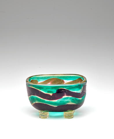Seguso Vetri d'Arte (1932-1973); attributed to Rare Bowlcirca 1940fasce bands in plum and pale green with gold inclusions, applied feet applied with gold inclusionsheight 4in (10cm); width 6 1/2in (16.5cm); depth 4 1/2in (11.5cm)
