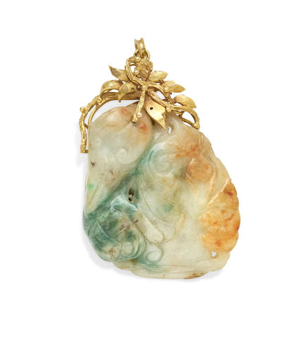 A carved jadeite jade and 14k gold pendant