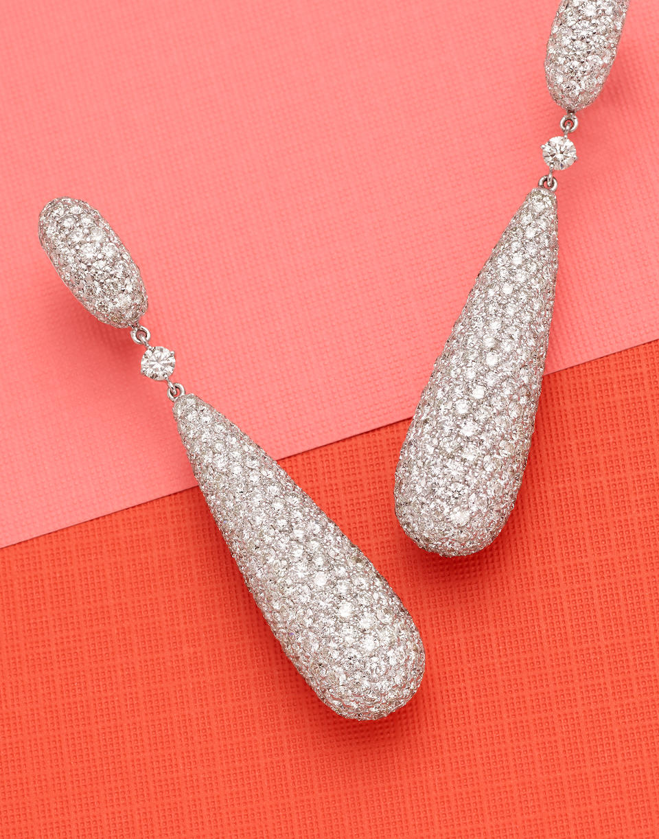 A pair of diamond and 18k white gold ear pendants