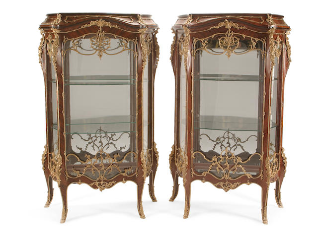 A pair of Louis XV style gilt bronze mounted tulip wood vitrine cabinets
