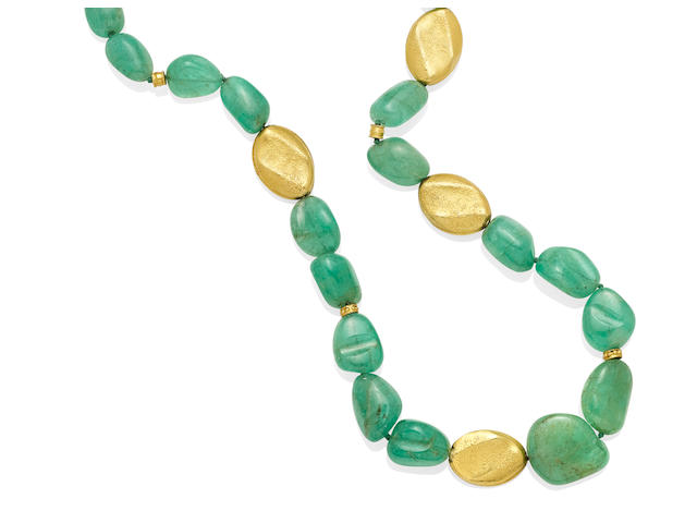 An emerald and gold bead necklace
