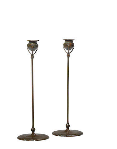 Tiffany Studios (1899-1919) Pair of Candlestickscirca 1905patinated bronze, stamped 'Tiffany Studios New York 1213'height 16 3/4in (43cm)