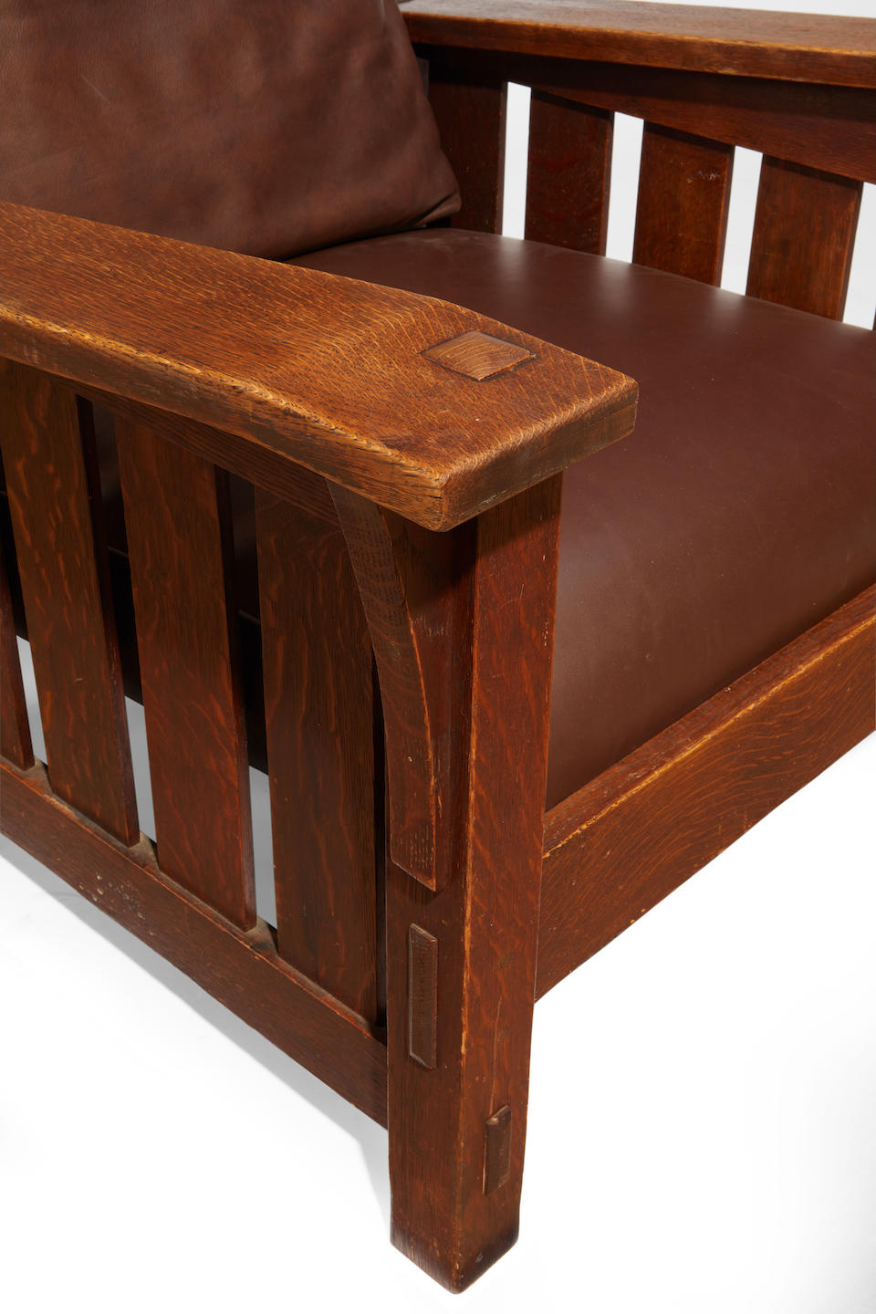 Gustav Stickley (1858-1942) Drop-Arm Morris Chaircirca 1905model no. 369, for the Craftsman Workshops of Gustav Stickley, Eastwood, New York, oak, later leather upholstered cushionsheight 40 (101cm); width 39 1/2in (95cm); depth 32 1/4in (82cm)