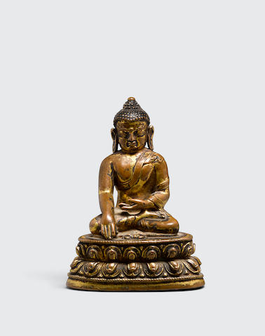 A gilt bronze figure of akshobhya Nepal, 14th century