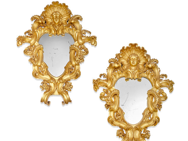 A monumental pair of Italian Baroque carved giltwood mirrors 18th century (2)