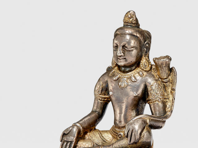 A PARCEL-GILT SILVER FIGURE OF MANJUSHRI NEPAL, 9TH/10TH CENTURY