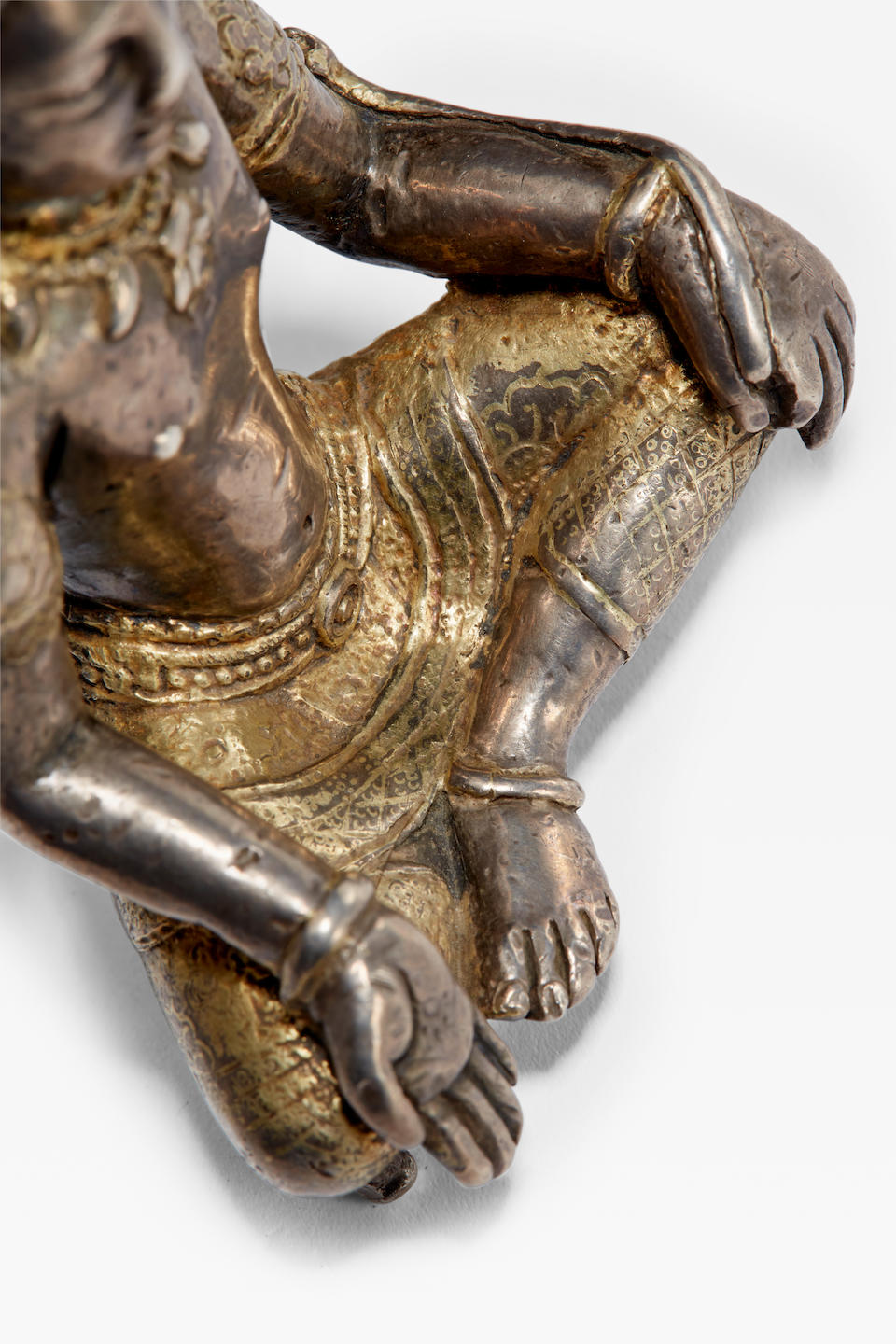 A PARCEL-GILT SILVER FIGURE OF MANJUSHRI NEPAL, 9TH/10TH CENTURY
