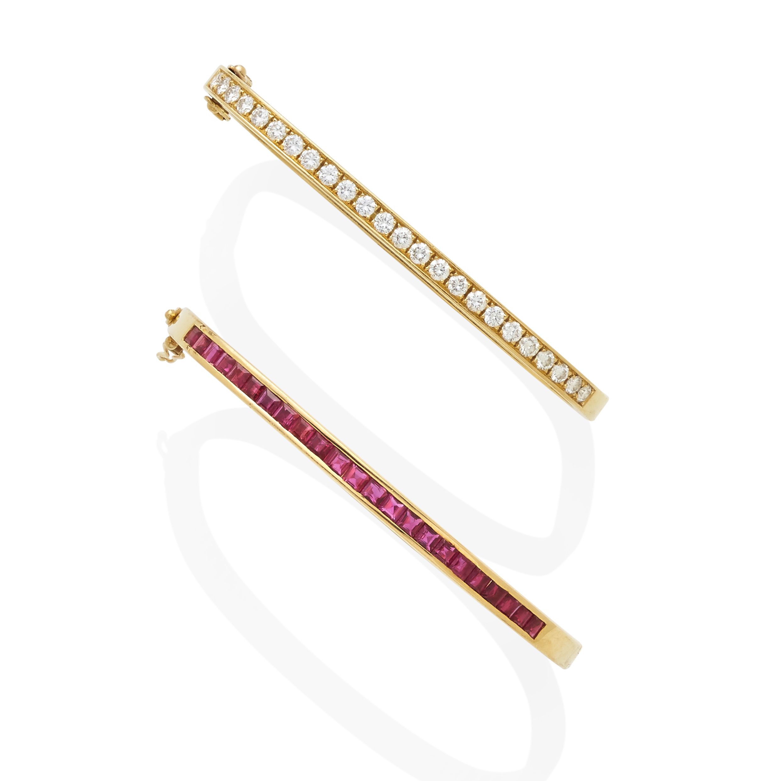 A diamond hinged bangle together with a ruby hinged bangle