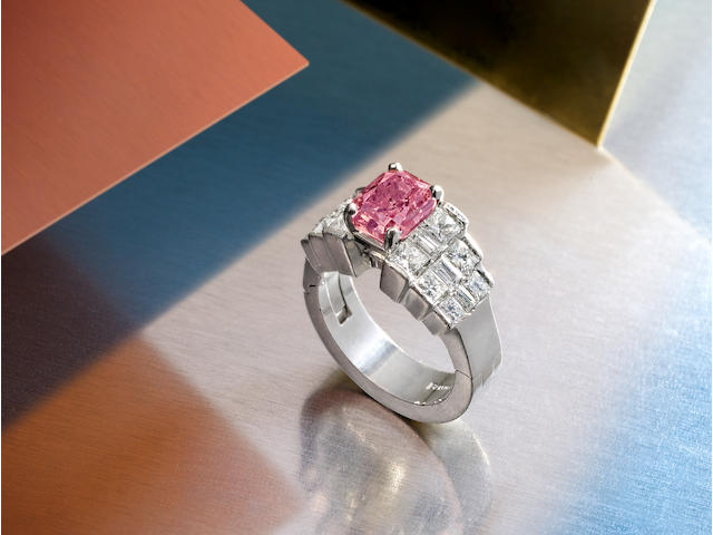 A fancy colored diamond and diamond ring