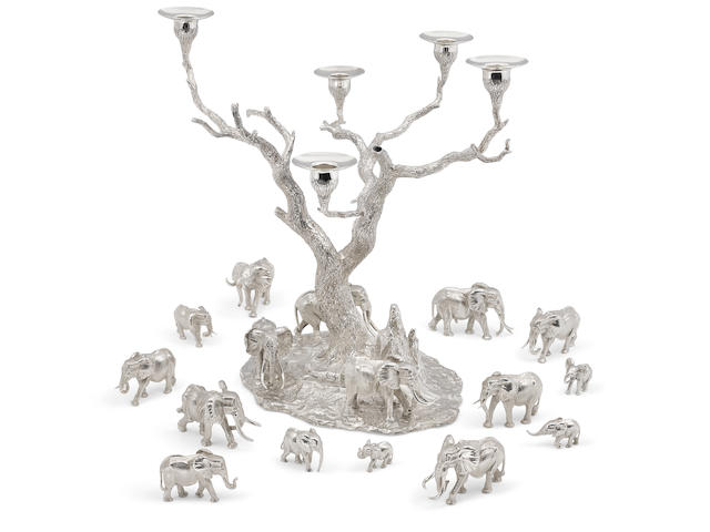 A Patrick Mavros sterling silver Tree of Lights candelabrum and assembled set of Thirteen modeled elephants each piece marked PM and the candelabrum signed 'Patrick Mavros' on base, circa 1998