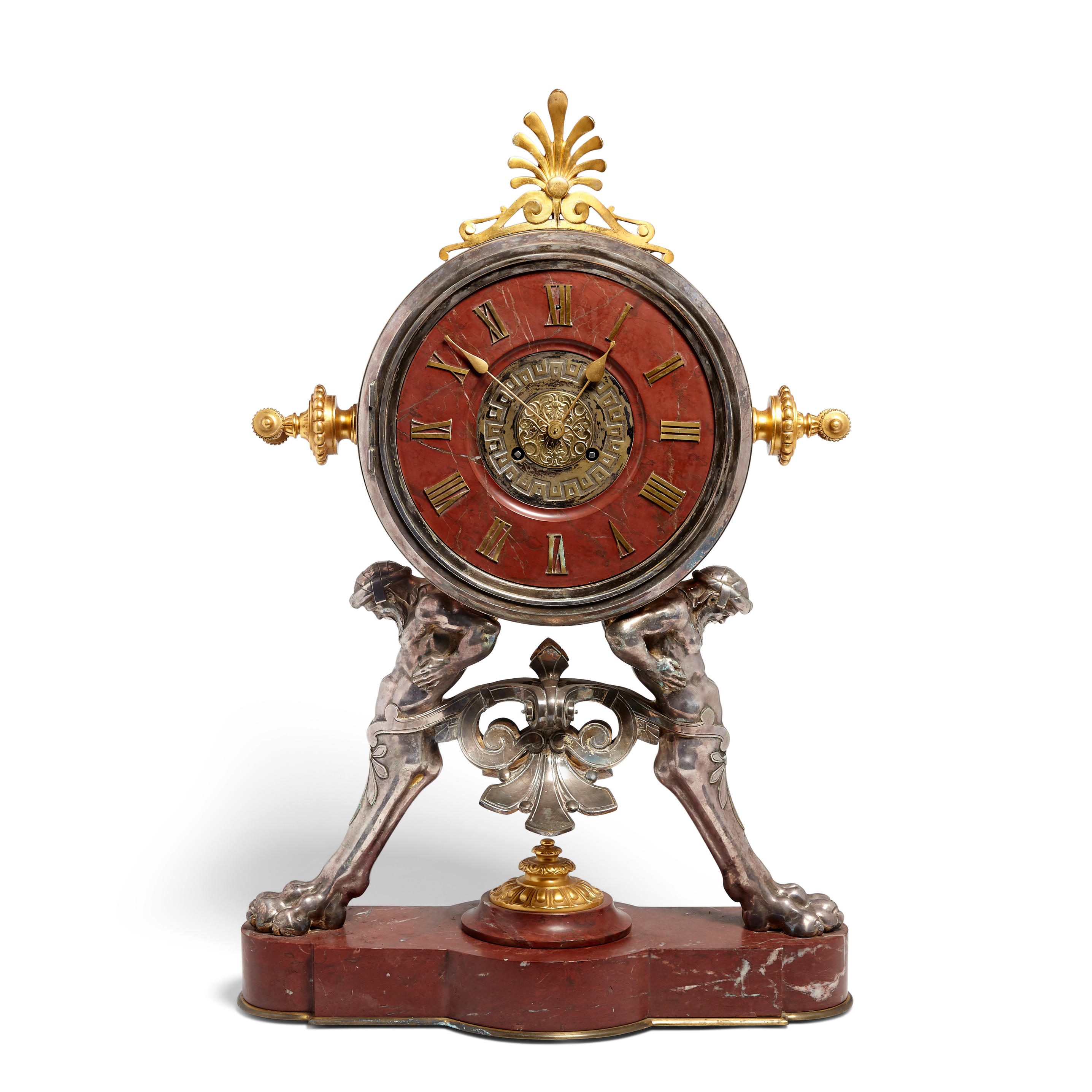 A French gilt and silvered bronze and rouge marble mantel clock