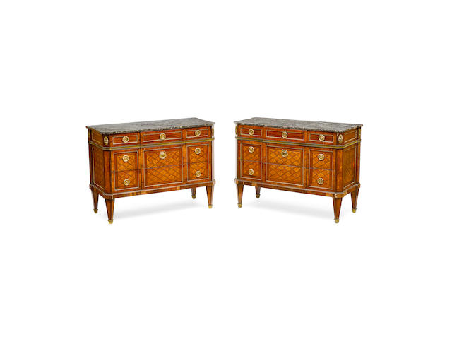 A Pair of Transitional Louis XV/XVI Marble Top Gilt Bronze Mounted Kingwood and Tulipwood Commodes,  Stamped twice P. Roussel and JME, third quarter 18th century