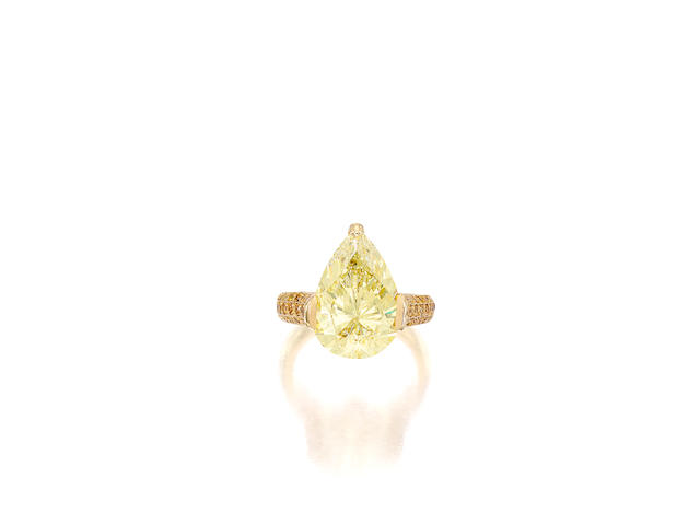 A fancy colored diamond and diamond ring
