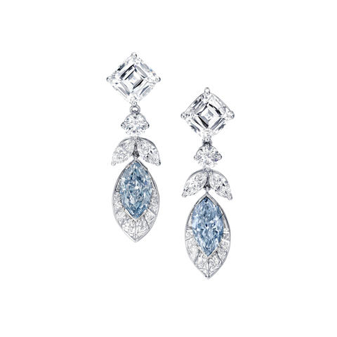 An important pair of fancy colored diamond and diamond earrings