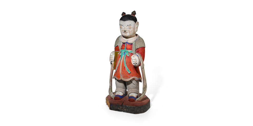 A fine wood figure of a Dong Ja (Boy Attendant) Joseon dynasty (1392-1897), dated 1706