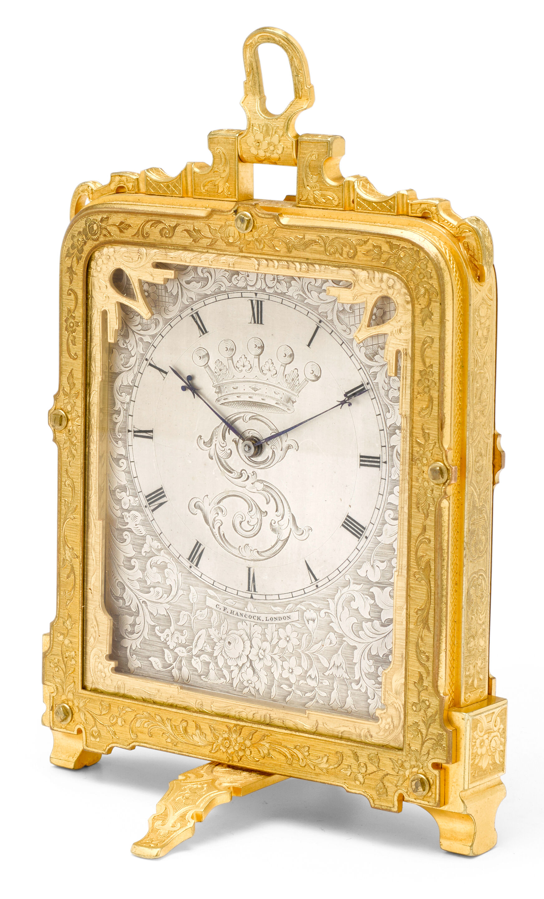 Bonhams A fine engraved gilt hour striking strut clock with
