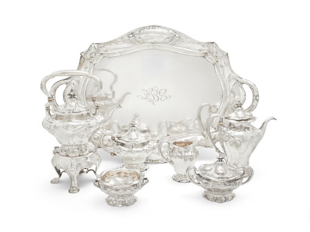 A FINE GORHAM ART NOUVEAU MARTEL&#201; SILVER SIX-PIECE TEA AND COFFEE SERVICE TOGETHER WITH MATCHING TWO-HANDLED TRAY by Gorham Mfg. Co., Providence, RI, circa 1900