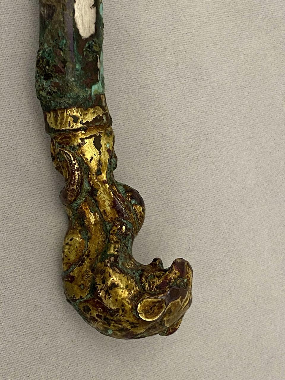 A fine and rare inlaid bronze garment hook  Warring States/Western Han period