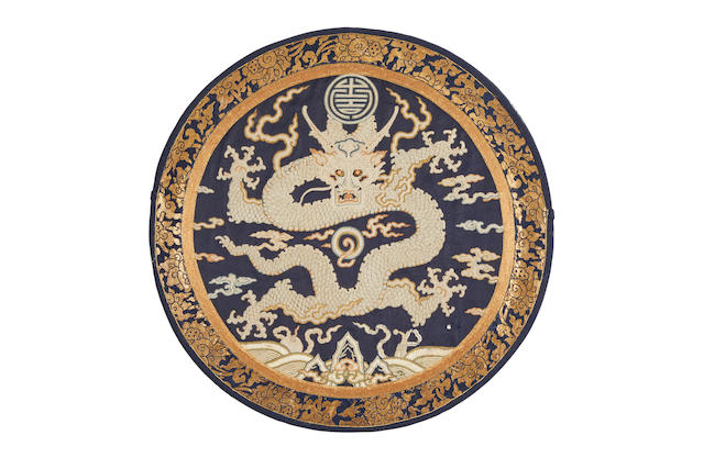 An embroidered silk and seed pearl dragon mirror case Early 18th Century