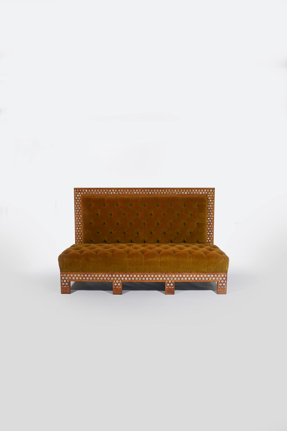 Louis C. Tiffany (1848- 1930) for Associated Artists Important Sofacirca 1879for the salon of Kemp House, New Yorkholly inlaid with mother of pearl, original tufted olive velvet upholsteryheight 43 1/4in (110cm); width 70in (178cm); depth 31in (79cm)