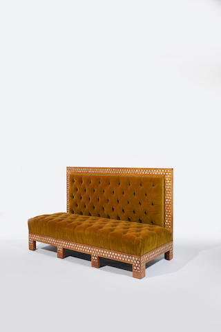 Louis C. Tiffany (1848- 1930) for Associated Artists Important Sofacirca 1879for the salon of Kemp House, New Yorkholly inlaid with mother of pearl, original tufted olive velvet upholsteryheight 43 1/4in (110cm); width 70in (178cm); depth 31in (79cm)