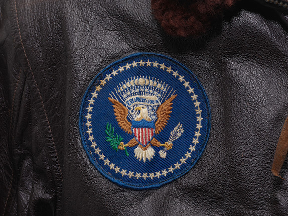 J.F.K.'S AIR FORCE ONE BOMBER JACKET GIVEN TO DAVID POWERS. An original U.S. Government issue G-1 flight jacket, with sewn patch of the Seal of the President of the United States over the right breast, originally owned by President John F. Kennedy and gifted to David Powers circa 1962-1963, image 7