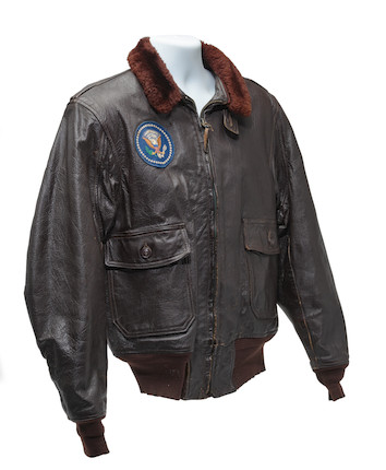 J.F.K.'S AIR FORCE ONE BOMBER JACKET GIVEN TO DAVID POWERS. An original U.S. Government issue G-1 flight jacket, with sewn patch of the Seal of the President of the United States over the right breast, originally owned by President John F. Kennedy and gifted to David Powers circa 1962-1963, image 4