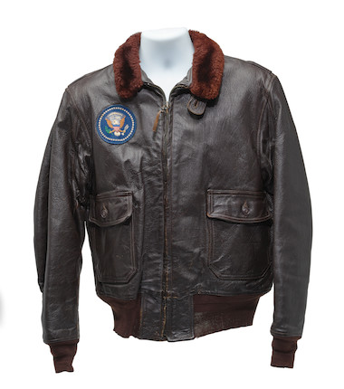 J.F.K.'S AIR FORCE ONE BOMBER JACKET GIVEN TO DAVID POWERS. An original U.S. Government issue G-1 flight jacket, with sewn patch of the Seal of the President of the United States over the right breast, originally owned by President John F. Kennedy and gifted to David Powers circa 1962-1963, image 8