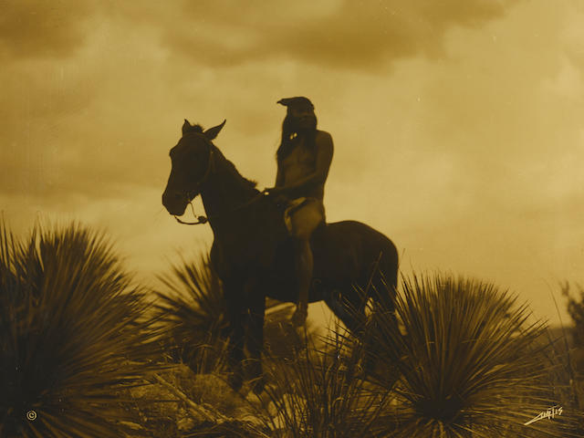 An Edward Sheriff Curtis orotone, "The Scout - Apache," 1906
