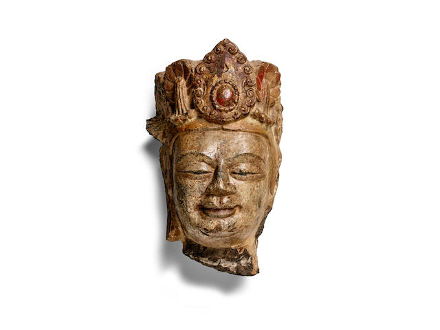 A RARE PAINTED LIMESTONE HEAD OF A BODHISATTVA  Northern Zhou/Sui dynasty, Late 6th century CE