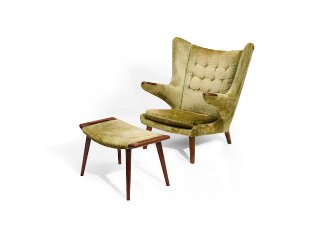 Hans J. Wegner (1914-2007) Papa Bear Chair and Ottomancirca 1950for AP Stolen, teak, velvet upholsteryheight of chair 38in (97cm); width 36in (92cm); depth 30in (76cm); height of ottoman 16in (41cm); width 27in (69cm); depth 15in (39cm)
