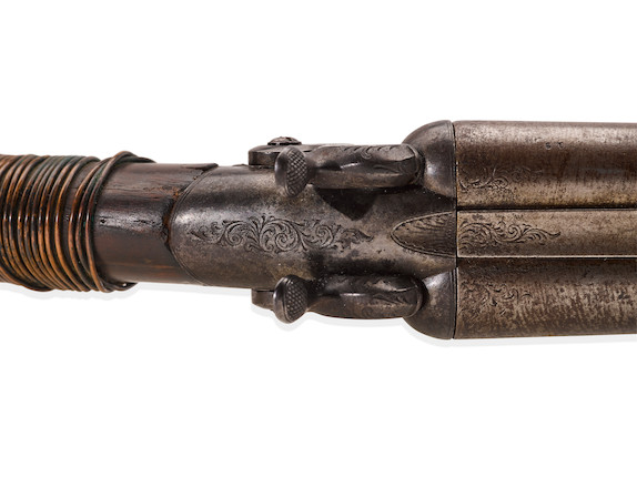 BILLY THE KID WHITNEY DOUBLE BARREL HAMMER SHOTGUN TAKEN FROM DEPUTY BOB OLINGER AND USED TO KILL HIM DURING BILLY THE KID'S DRAMATIC LINCOLN COUNTY COURTHOUSE ESCAPE ON APRIL 28, 1881.  Serial no. 903, circa 1880, 10 gauge 25 1/4 inch round brown Damascus twist pattern. image 8
