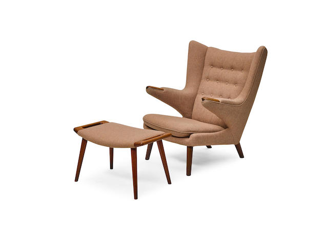 Hans J. Wegner (1914-2007) Papa Bear Chair and Ottomancirca 1950teak, upholstery, with Danish control tag to underside of chairheight of chair 39in (99cm); width 35in (89cm); depth 36in (91.5cm); height of ottoman 16in (41cm); width 27 1/2in (70cm); depth 16in (41cm)