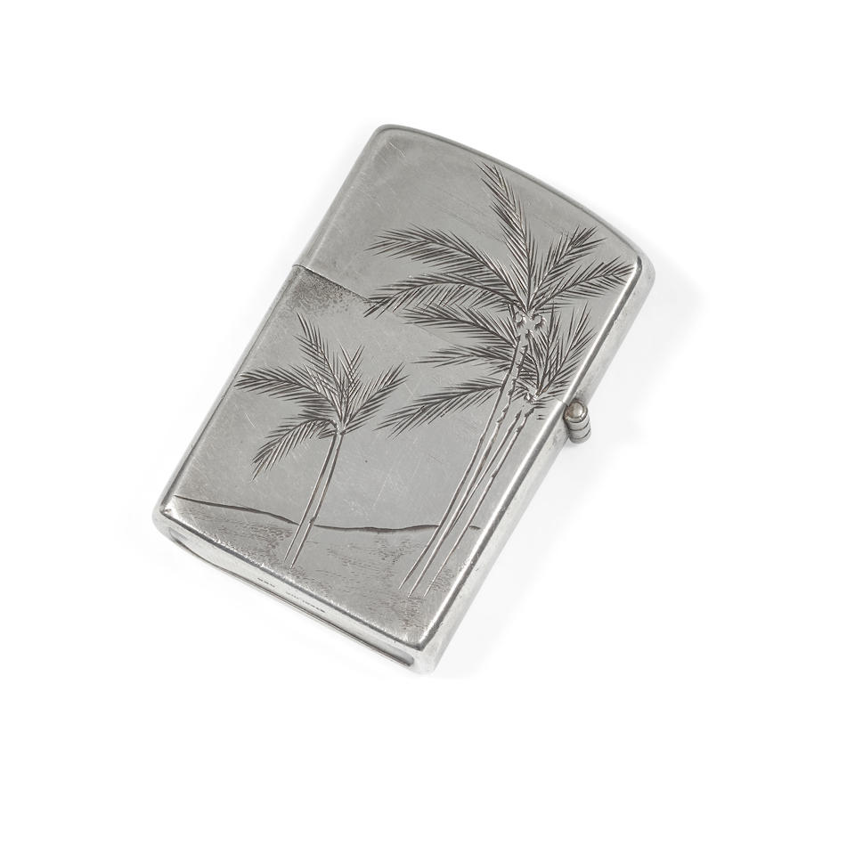ENIWETOK ATOLL ATOMIC TEST SOUVENIR ATOMIC BLAST-ENGRAVED LIGHTER. Sterling silver lighter case, 1950s, engraved with an atomic mushroom cloud above a map of Eniwetok Atoll,