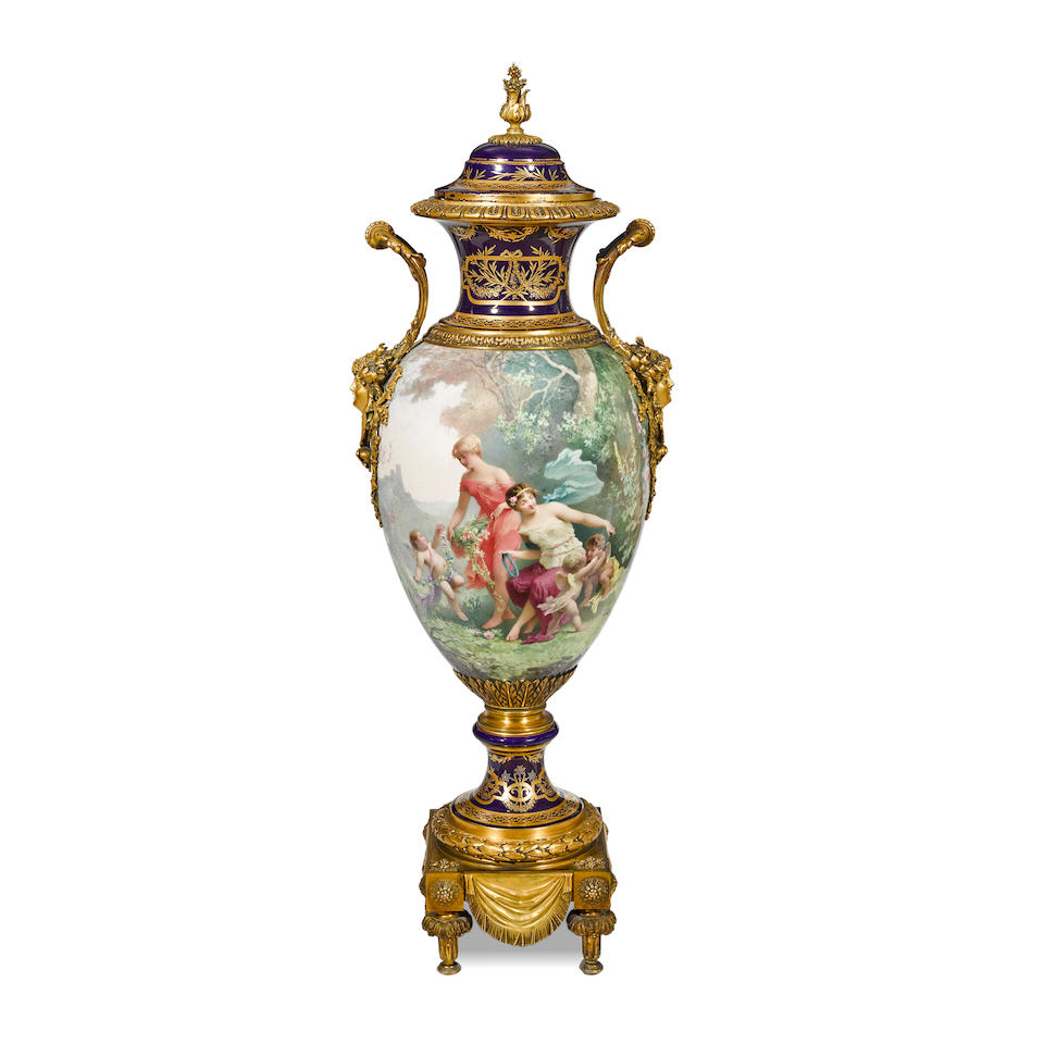 A FRENCH GILT BRONZE MOUNTED S&#200;VRES STYLE PORCELAIN COVERED URN19th century