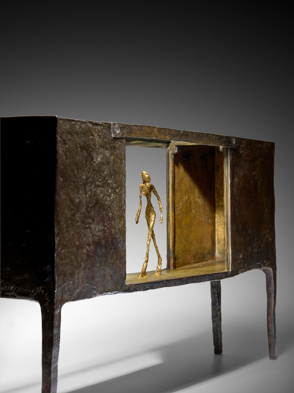 ALBERTO GIACOMETTI (1901-1966) Figurine entre deux maisons 11 5/8 x 21 x 3 11/16 in (29.5 x 53.3 x 9.4 cm) (Conceived in 1950. This bronze version cast in 1952 by the Alexis Rudier Foundry in an edition of 6, of which two are numbered 6/6)