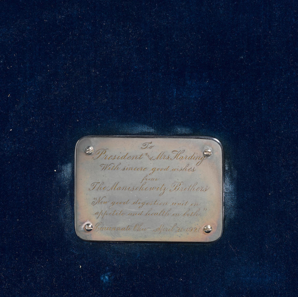 A MATZOS BOX PRESENTED BY THE MANISHEVITZ BROTHERS TO WARREN G. HARDING. Silver plate mounted black morocco matzos box with blue velvet interior lining,