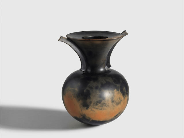 Dame Magdalene Odundo (born 1950) Saggar Fired Vase1985burnished and carbonized terracotta, incised 'Odundo 1985'; sold together with Courcoux & Courcoux gallery postcard depicting the work at the time of acquisitionheight 13 1/6in (33.2cm); width 10 1/2in (27cm); depth 9 3/4in (25cm)