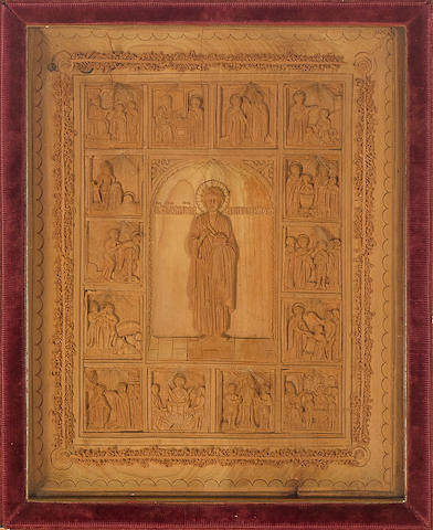 A RUSSIAN CARVED SANDALWOOD ICON OF ST. PANTELEIMON WITH SCENES OF HIS LIFEMid-19th century