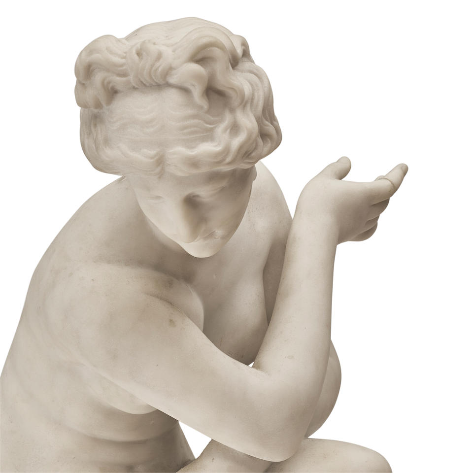 A CARVED WHITE MARBLE FIGURE: THE CROUCHING VENUSAfter the antique, 19th century