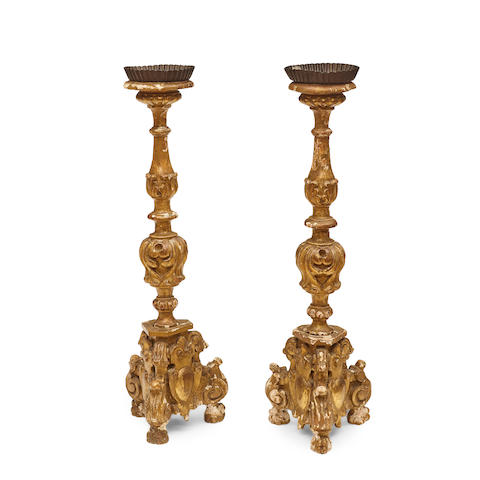 A PAIR OF BAROQUE STYLE CARVED GILTWOOD ALTAR STICKS