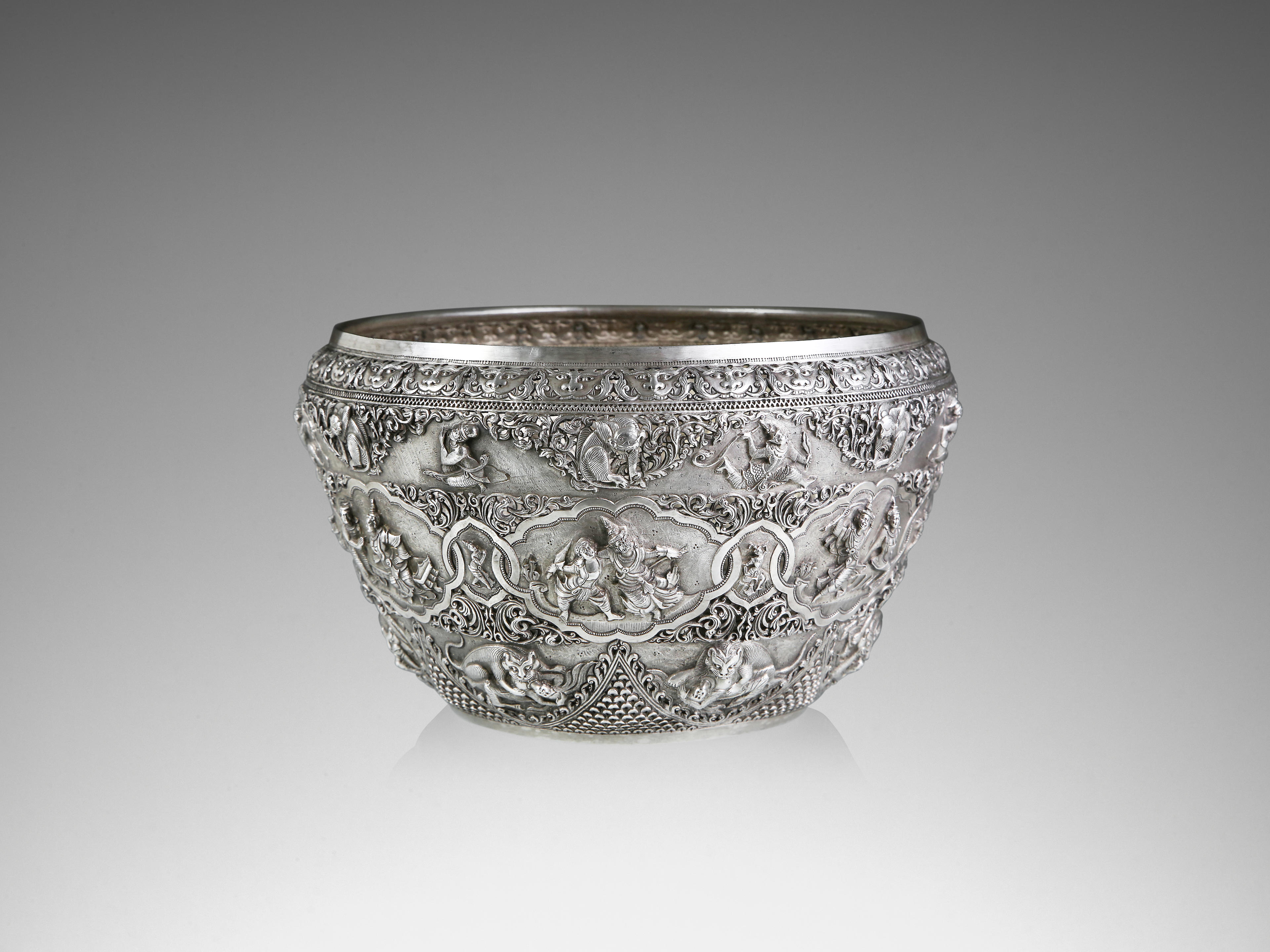 A SILVER OFFERING BOWL WITH SCENES OF THE RAMAYANA LOWER BURMA (MYANMAR), CIRCA 1915